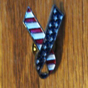American flag lapel pin shaped like a peace sign